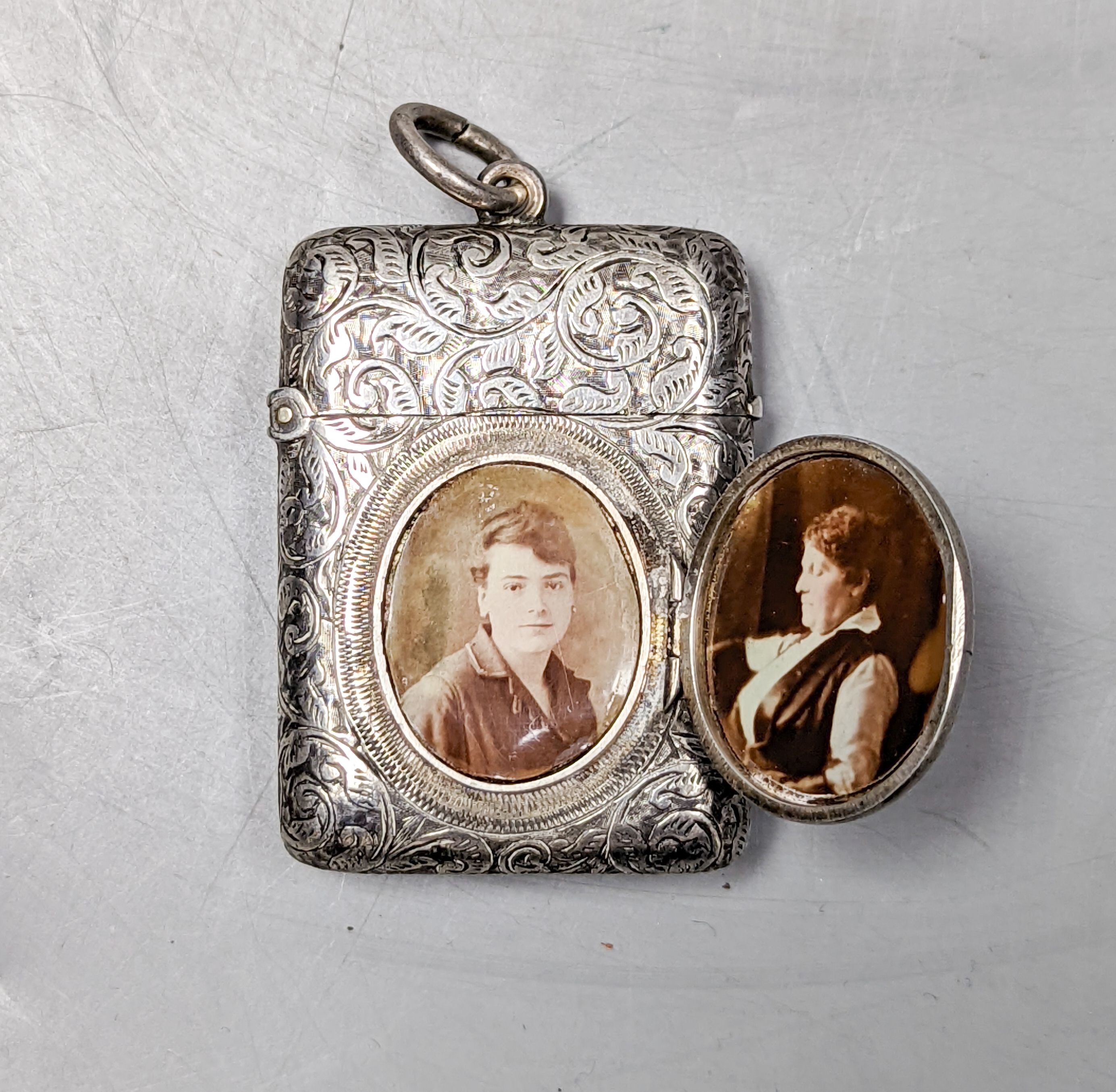 A late Victorian engraved silver vesta case with locket compartment, Abraham Meyer Blanckensee, Birmingham, 1894, 49mm.